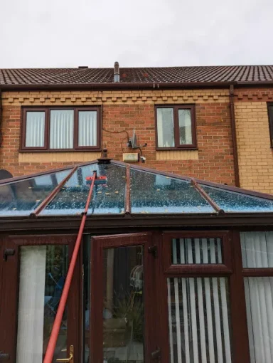 Pristine conservatory roof after a professional cleaning service, free from dirt, moss, and grime for a sparkling finish.